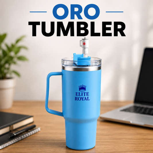 Blue tumbler with 'Elite Royal' branding on a desk with a laptop and plant in the background.
